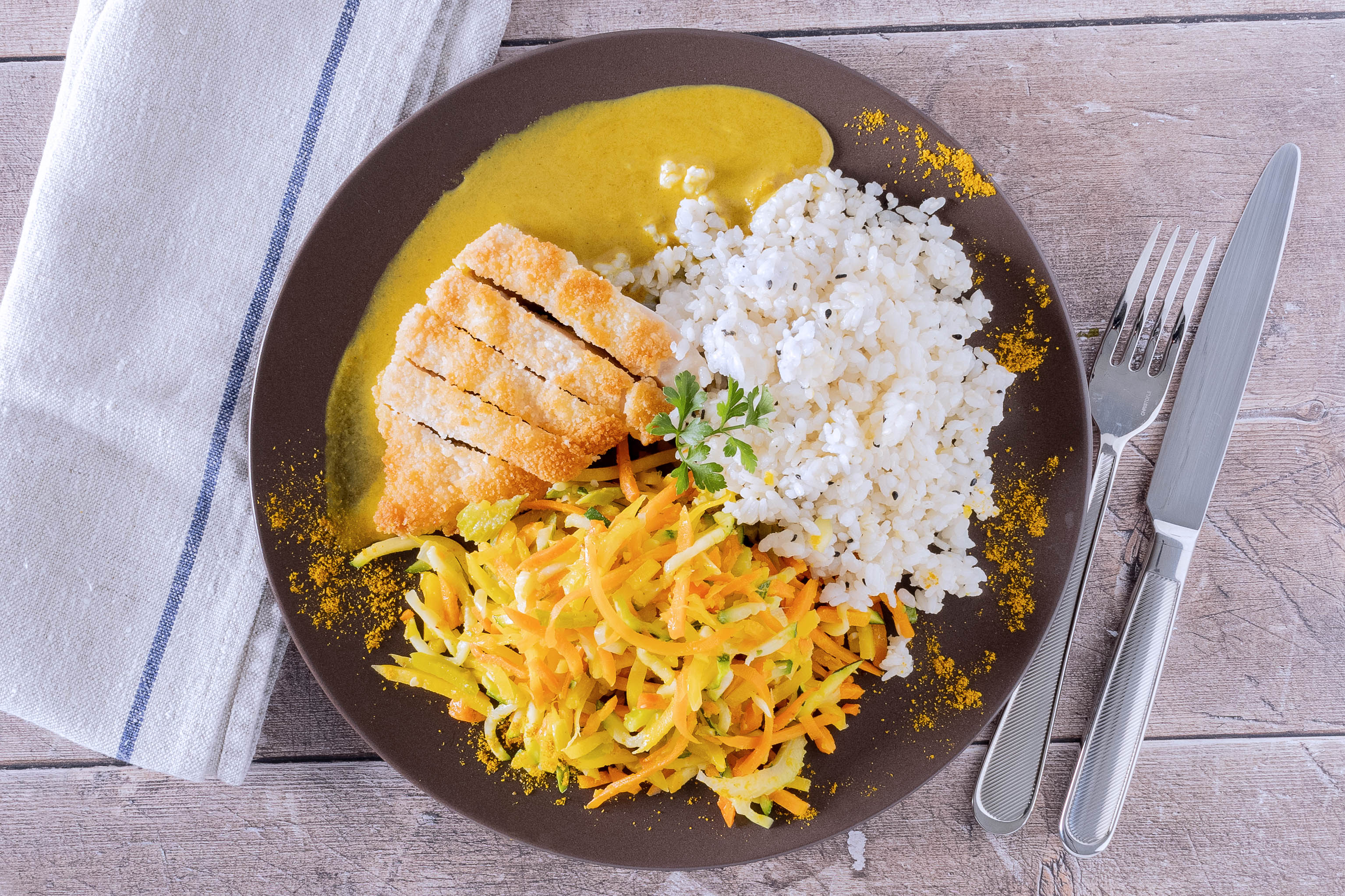 Chicken katsu curry with rice and vegetable julienne
