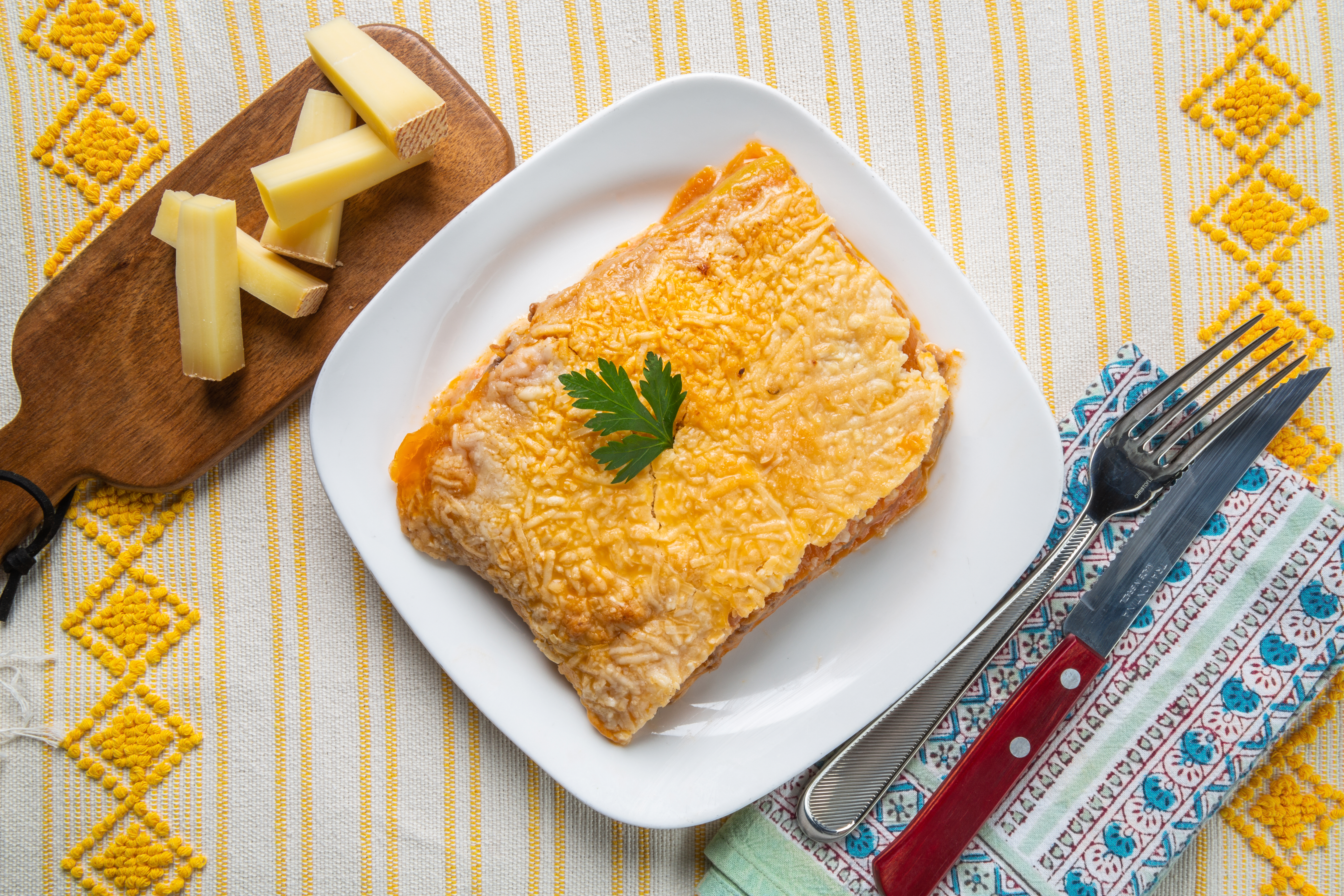 A slice of lasagna top down on a plate