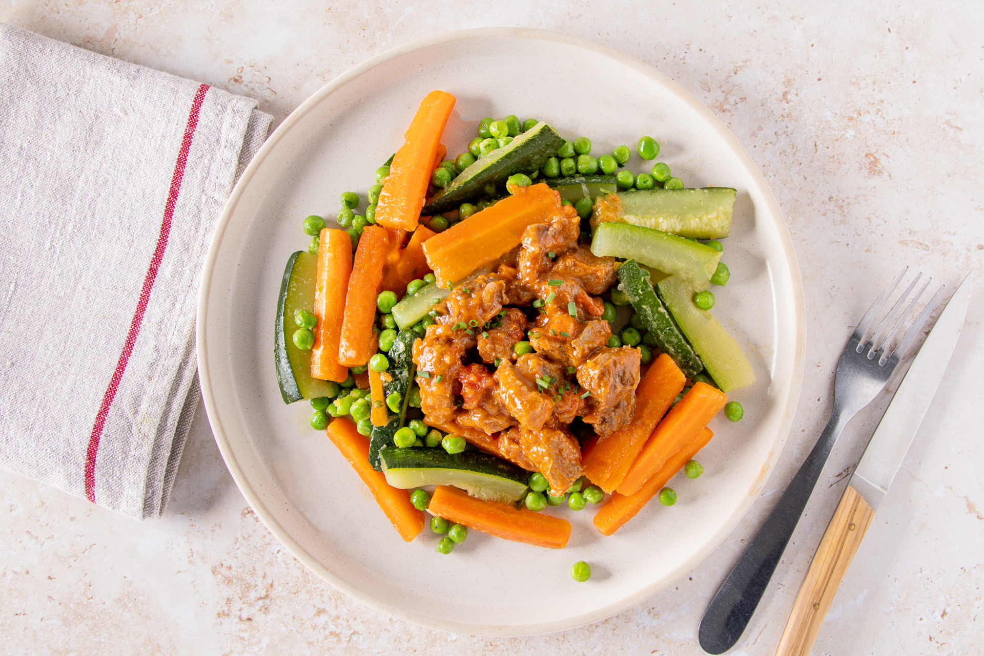 Lamb stew on a bed of carrots and courgette